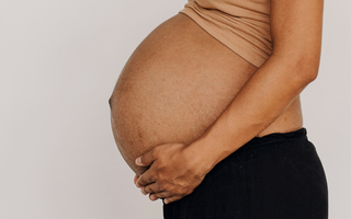 How is the baby positioned in the womb?