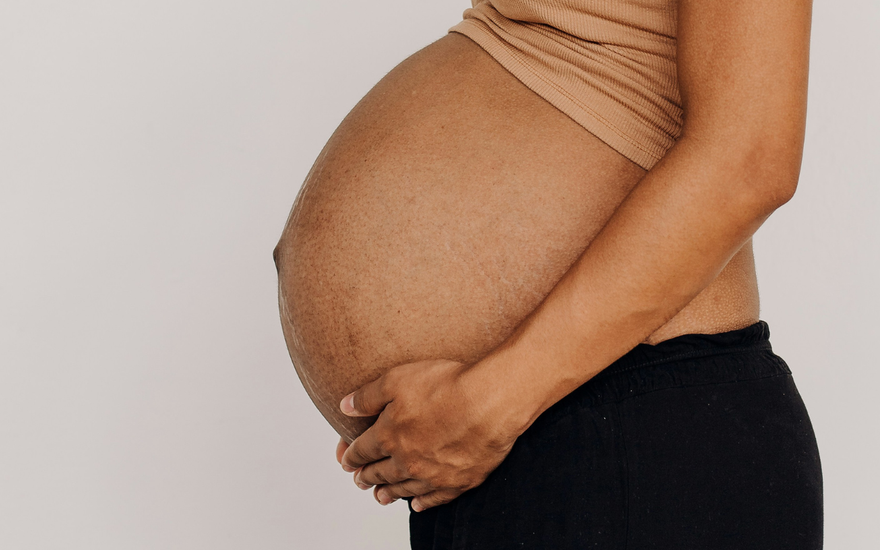 How is the baby positioned in the womb?