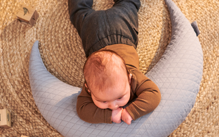 When can babies sleep on their stomach?