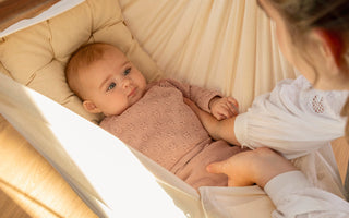 When can babies hold their head up?